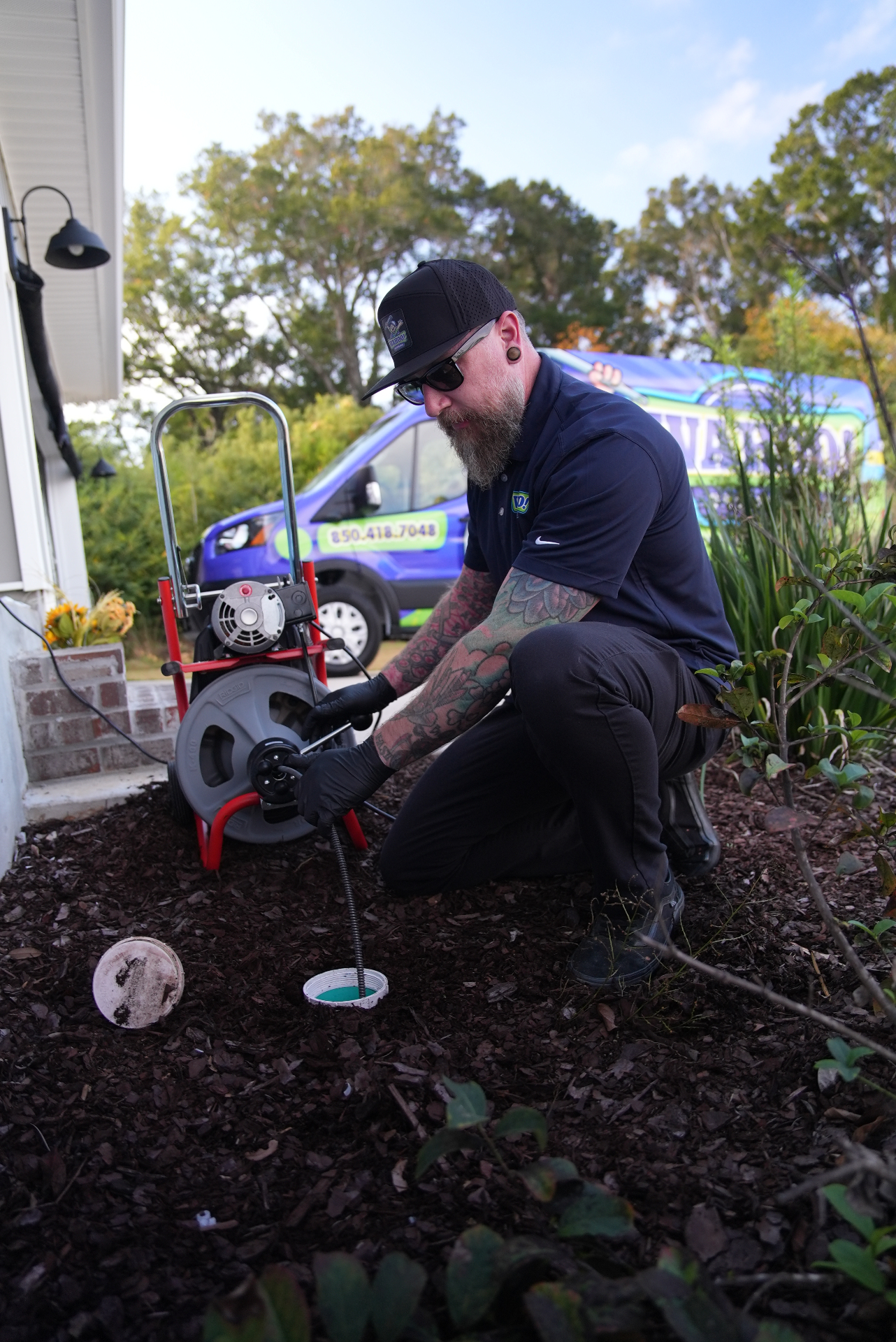 Wahoo technician clearing a drain